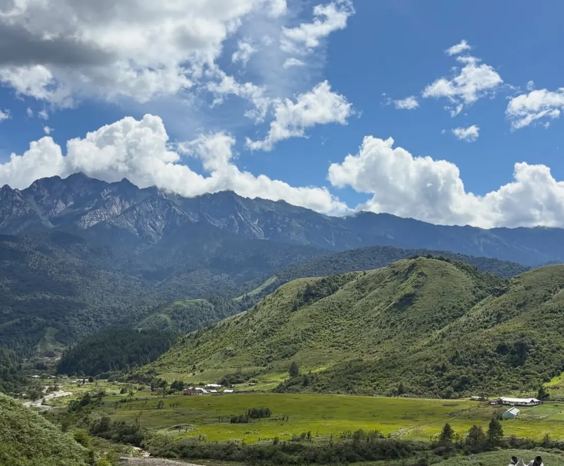 The Mechukha valley under big white clouds