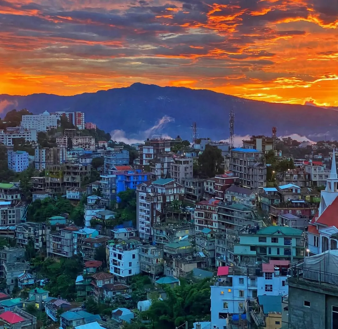 Aizawl under an orange sunset sky